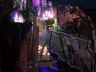 A photograph of the inside of Meow Wolf, an indescribable interior space.